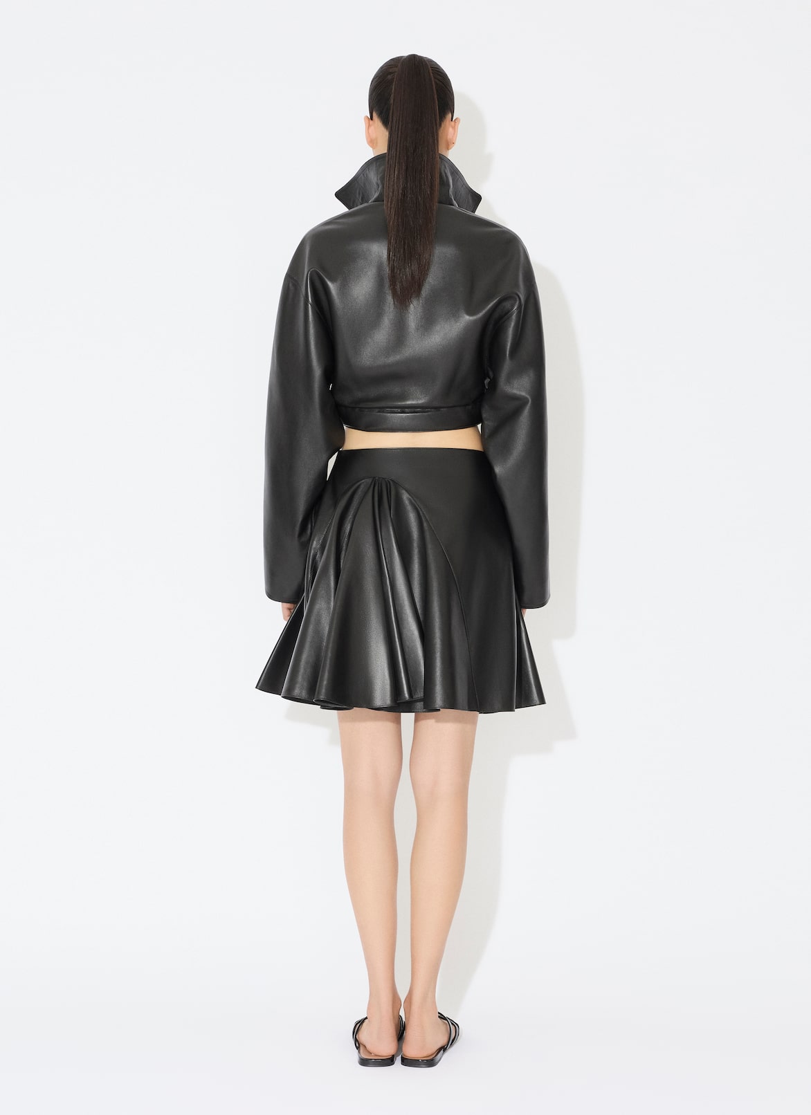 LEATHER ASYMMETRICAL SKIRT ALAÏA BLACK LEATHER ASYMMETRICAL SKIRT
